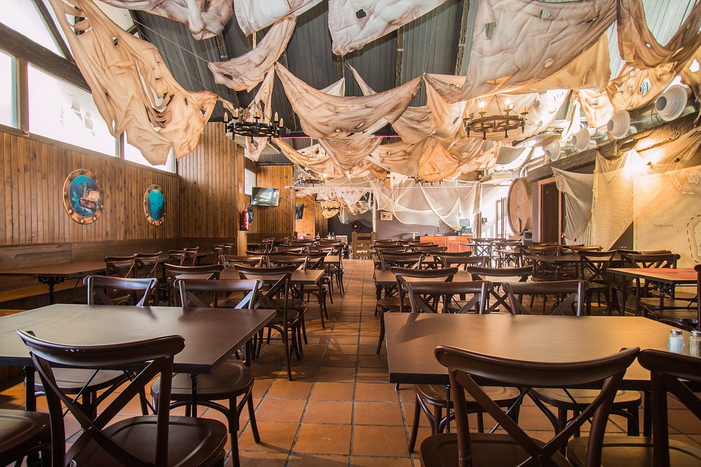 Pirate-themed restaurant with sail canopies at Magic Tropical Splash