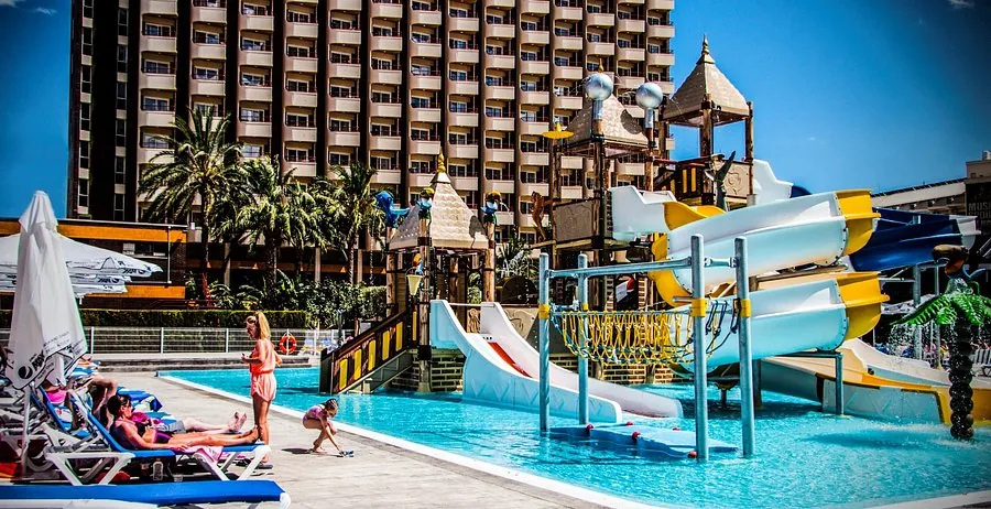 Family pool area with water slides at Rosamar Hotel Benidorm