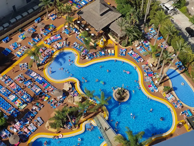 Aerial view of the large lake-style swimming pool and sun terraces at Flamingo Oasis Benidorm