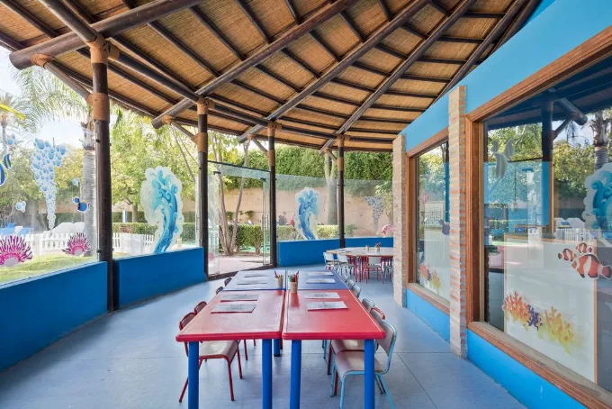 Open-air kids' club and playground at Meliá Benidorm with marine-themed murals