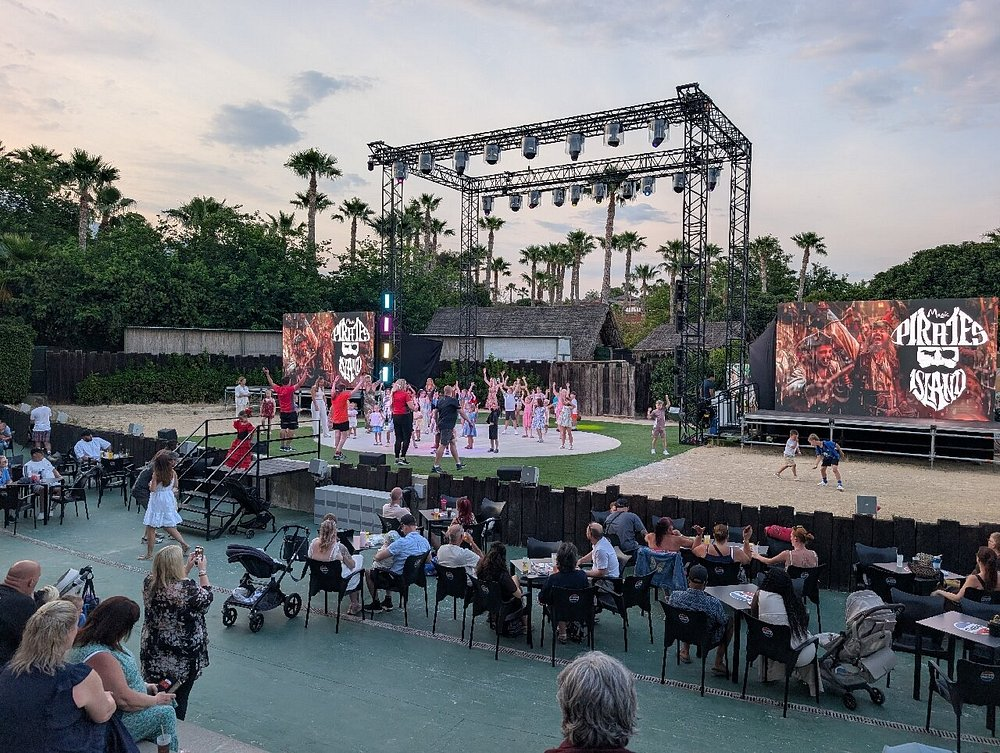 Evening pirate-themed animation show with families watching at Magic Pirates Island Resort