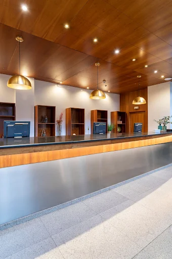 Long wood-panelled reception desk at Meliá Benidorm