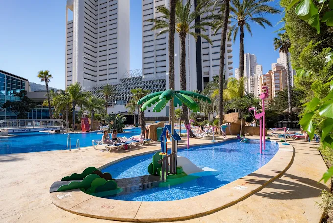 Children's pool with flamingo sculptures and shaded splash area at Flamingo Oasis Benidorm