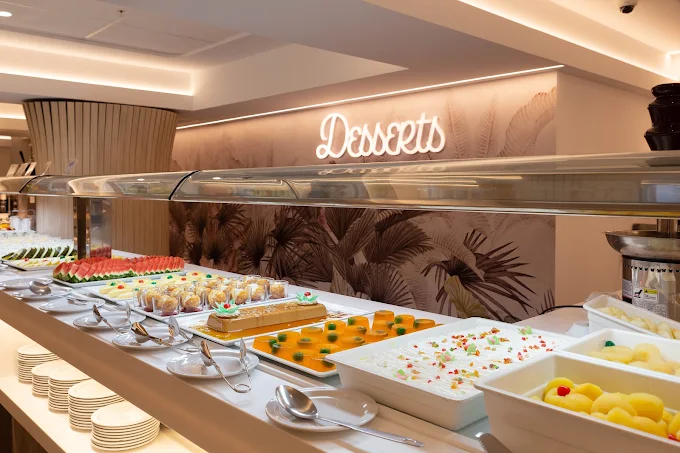 Dessert counter with cakes, fruit and Christmas sweets at Ambassador Playa 2