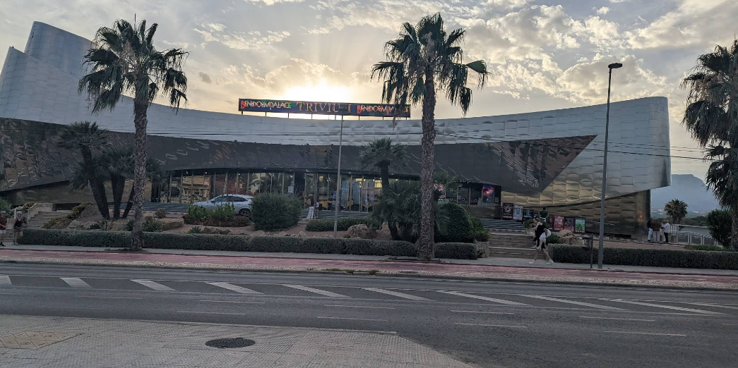 Benidorm Palace exterior at sunset with Trivium show sign