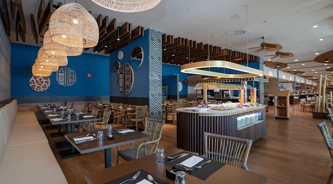 Themed restaurant with African-inspired decor and live cooking station at Flamingo Oasis Benidorm