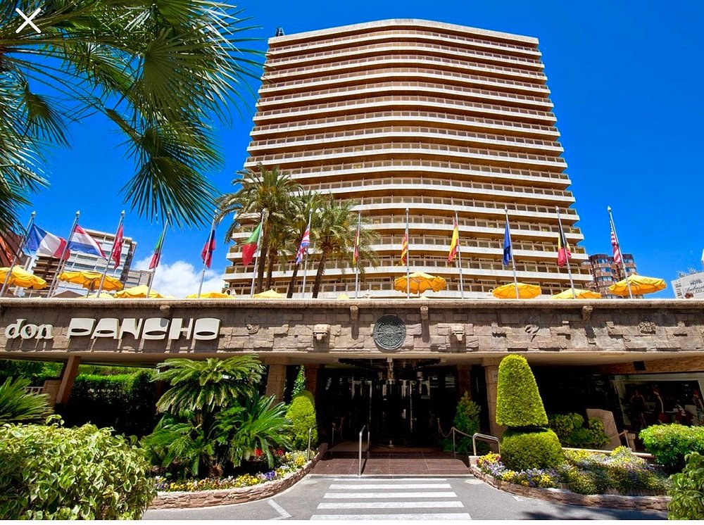 Hotel Don Pancho Benidorm front entrance in daylight with flags