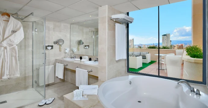 Suite bathroom at Meliá Benidorm with jacuzzi and terrace overlooking Benidorm skyline